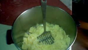 Mash the potatoes in a pot