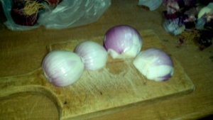 Peel onions and cut them in half